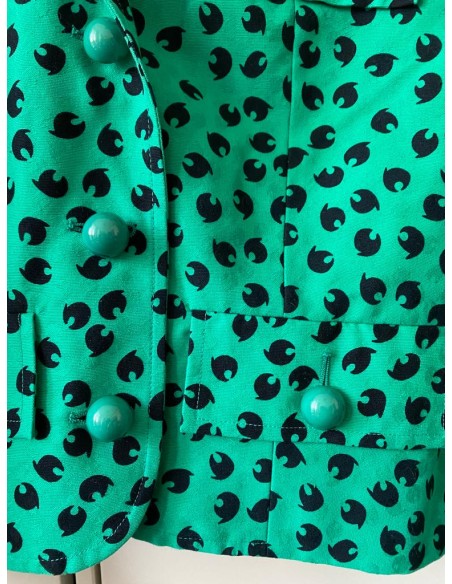 Completo verde con motivi neri